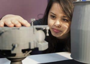 Kara Morgan, a Penn State freshman majoring in aerospace engineering, examined a 3-D printed model of the Lunar Lion spacecraft during a team meeting on March 21. Morgan is part of a team of students from a variety of majors who are combining their disciplines and expertise in a global race to land and operate a robotic spacecraft on the Moon by 2015.